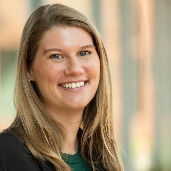 Portrait of Kelly Schindler smiling in a green top.